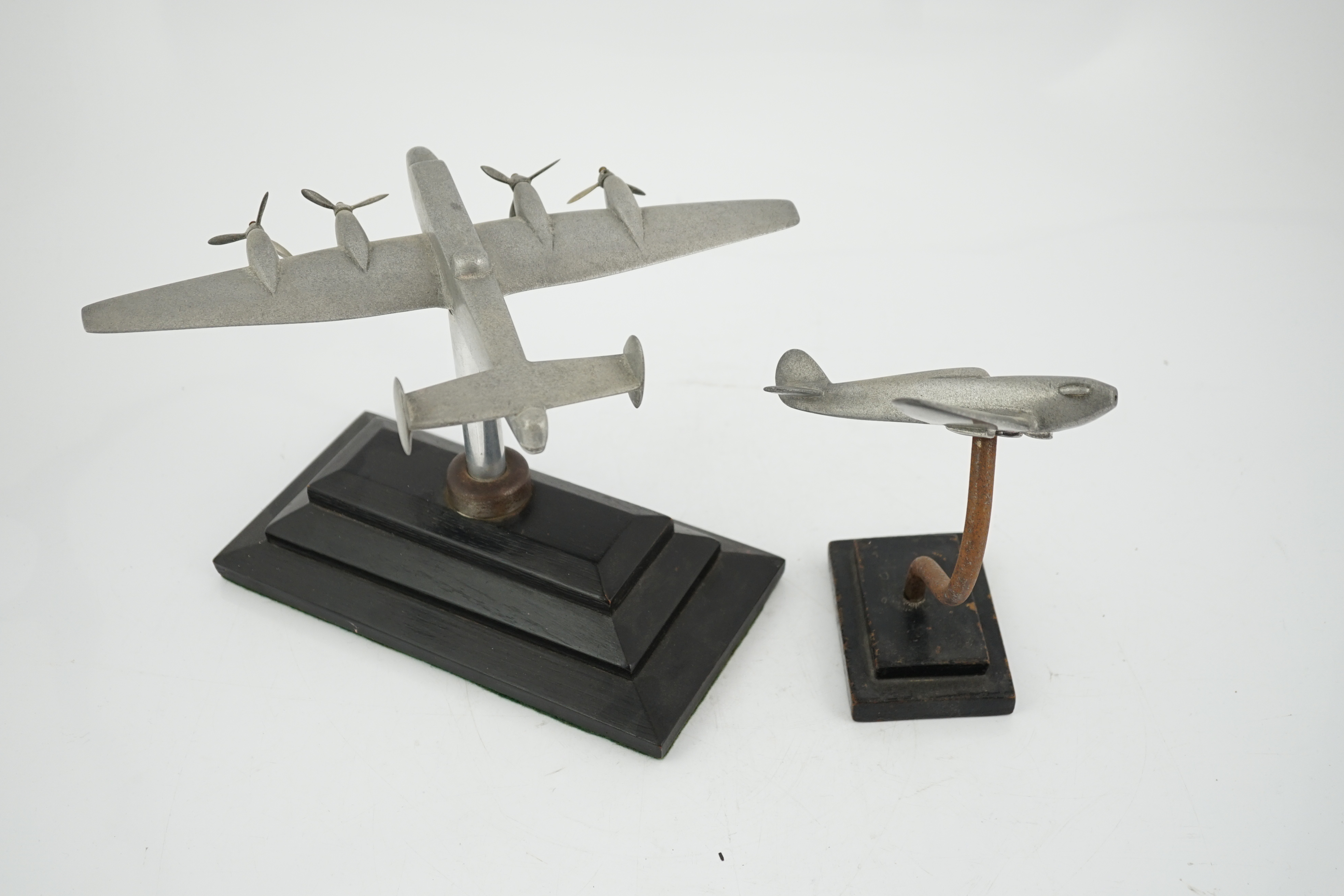 Two cast aluminium military aircraft models mounted on stepped wooden bases; a Halifax bomber, wingspan 30.5cm, and a Hawker Hurricane, wingspan 18cm